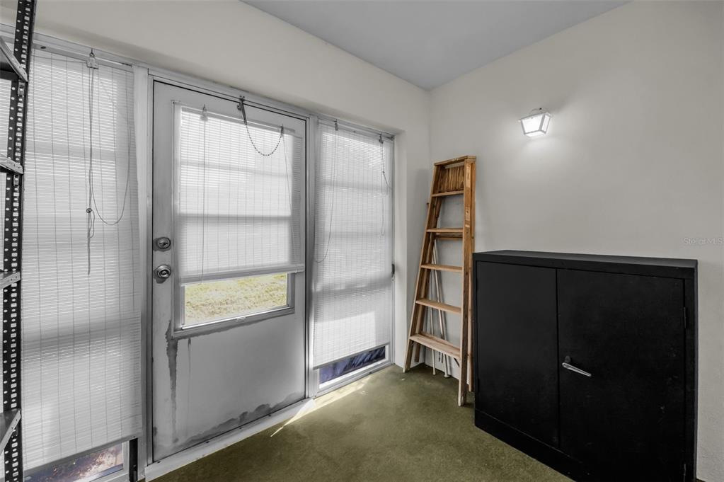 1701 Pinehurst Road, Unit 4F Dunedin, FL 34698 - Photo 30 of 56 a view of walk in closet with empty racks