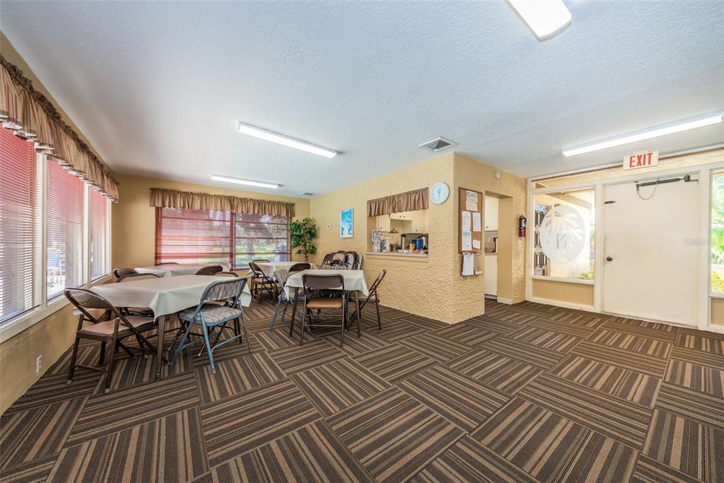 1701 Pinehurst Road, Unit 4F Dunedin, FL 34698 - Photo 36 of 56 a living room with furniture a window and a table