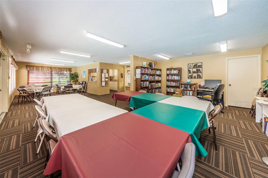 1701 Pinehurst Road, Unit 4F Dunedin, FL 34698 - Photo 39 of 56 a room with furniture and a table