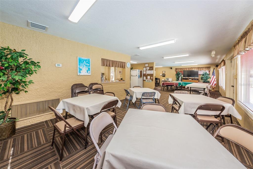 1701 Pinehurst Road, Unit 4F Dunedin, FL 34698 - Photo 40 of 56 a very nice looking room with chairs