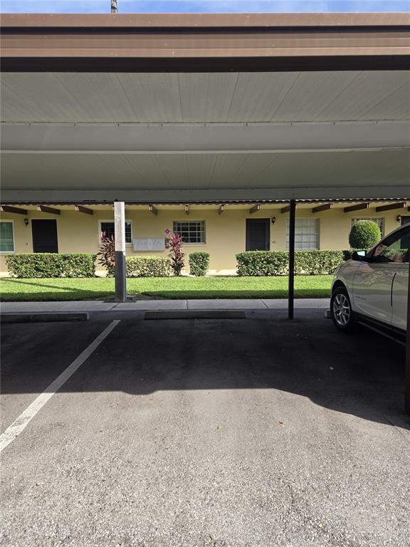 1701 Pinehurst Road, Unit 4F Dunedin, FL 34698 - Photo 9 of 56 a view of car parking