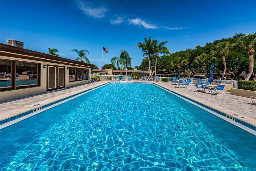 1701 Pinehurst Road, Unit 4F Dunedin, FL 34698 - Photo 10 of 56 a view of a house with swimming pool