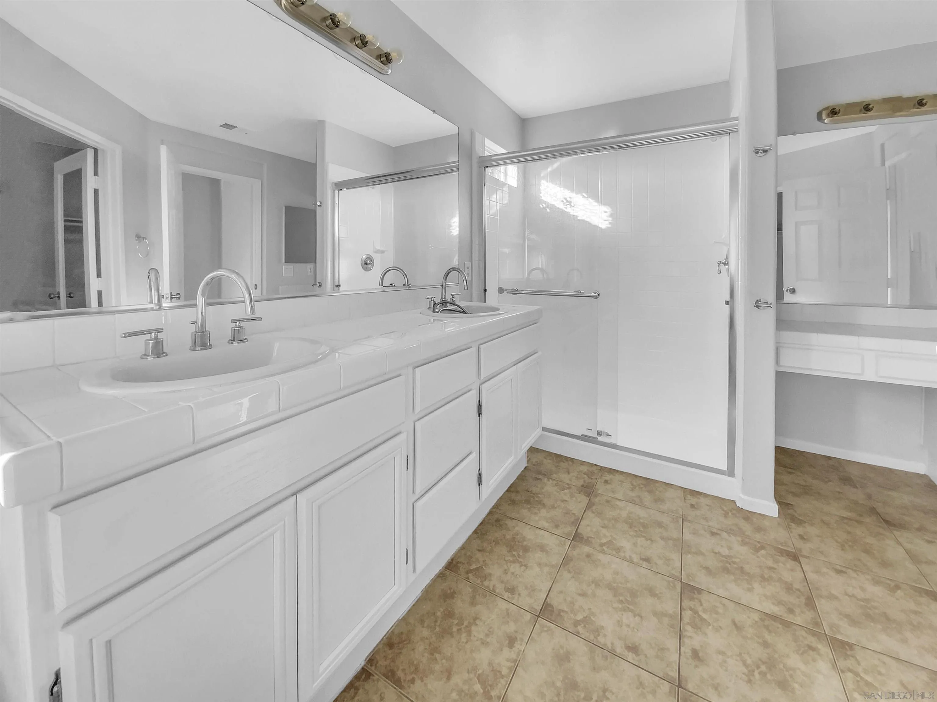 1272 Santa Lucia Road Chula Vista, CA 91913 - Photo 5 of 25 a bathroom with a double vanity sink and a mirror