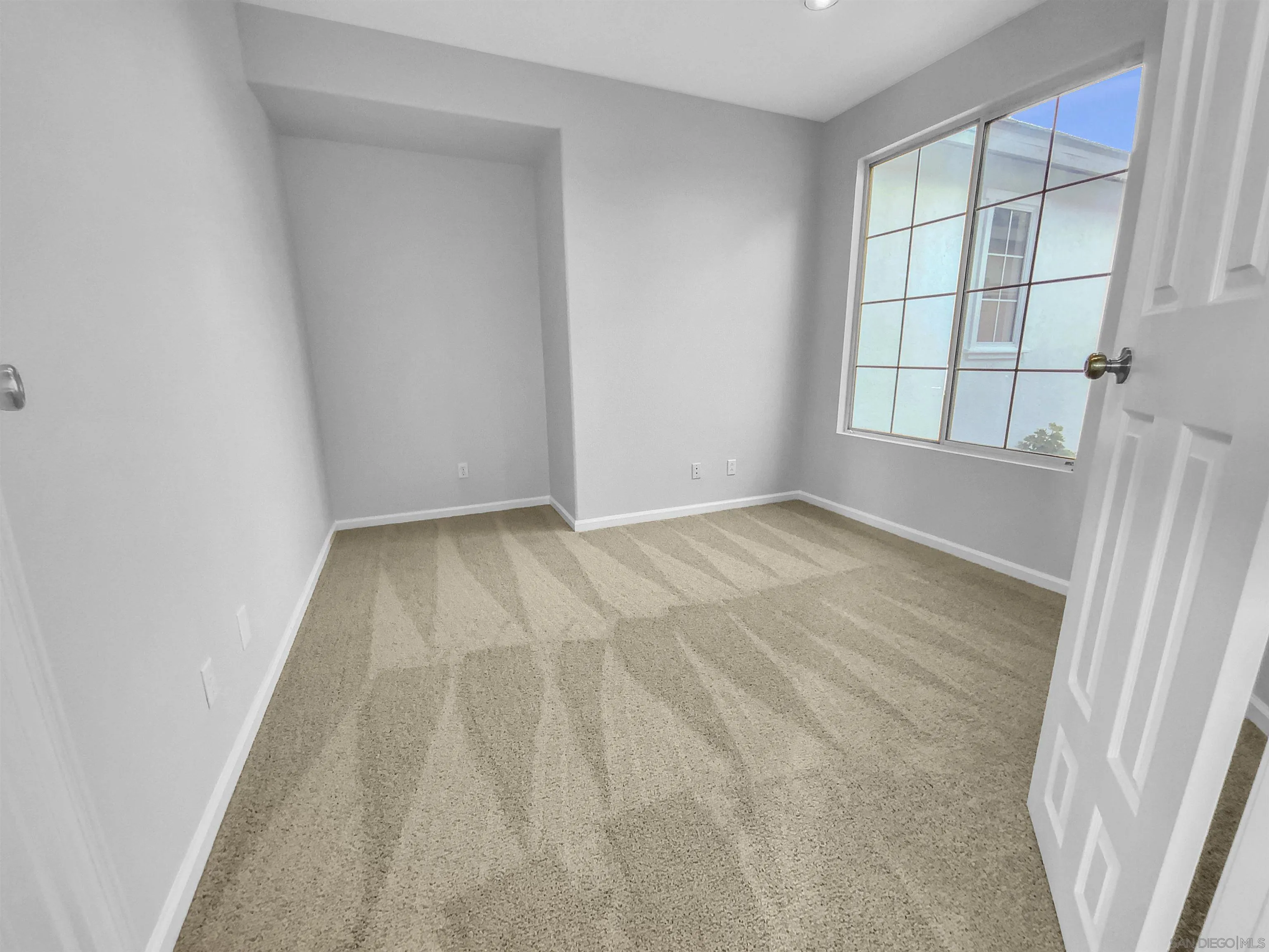 1272 Santa Lucia Road Chula Vista, CA 91913 - Photo 8 of 25 wooden floor in an empty room with a window