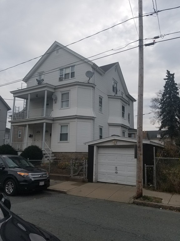 18 Mott Street Fall River, MA 02721 - Photo 1 of 27 a car parked in front of a house