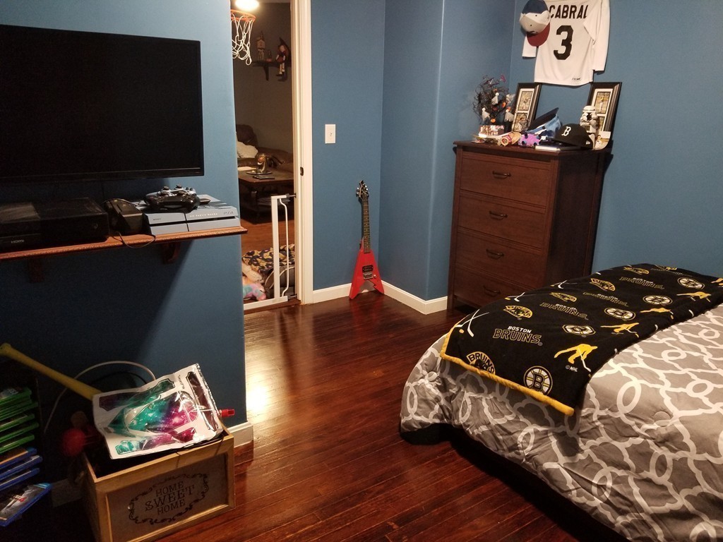 18 Mott Street Fall River, MA 02721 - Photo 13 of 27 a bedroom with a bed and a flat screen tv