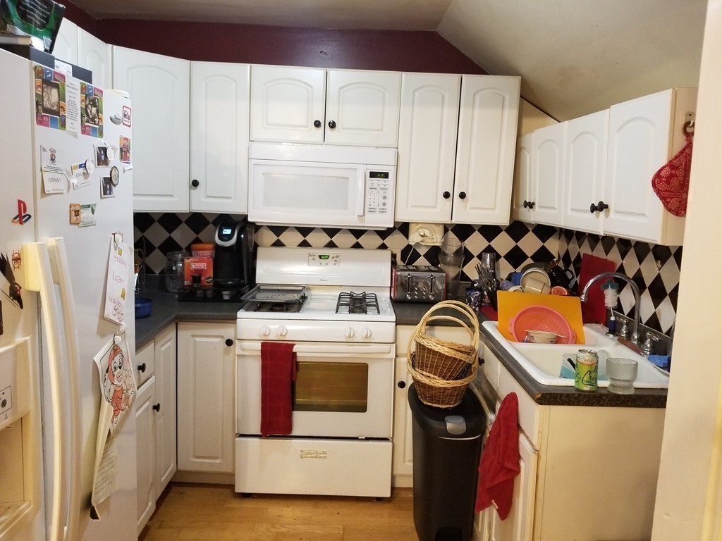 18 Mott Street Fall River, MA 02721 - Photo 17 of 27 a utility room with dryer and washer
