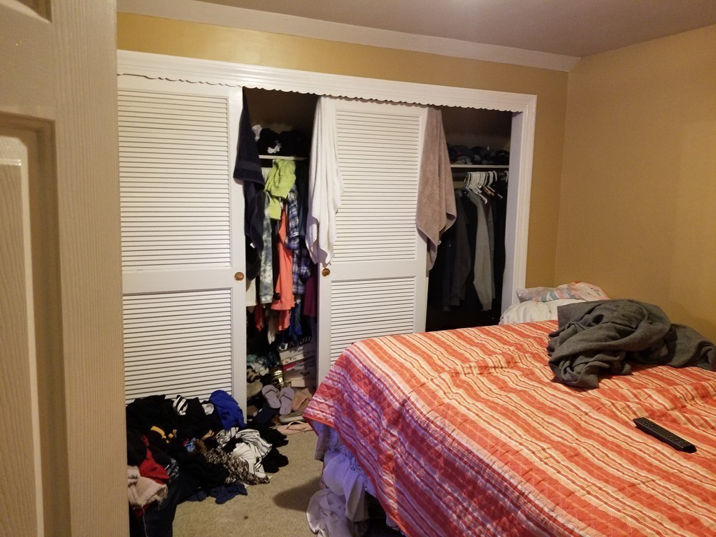 18 Mott Street Fall River, MA 02721 - Photo 21 of 27 a bedroom with a bed and a closet