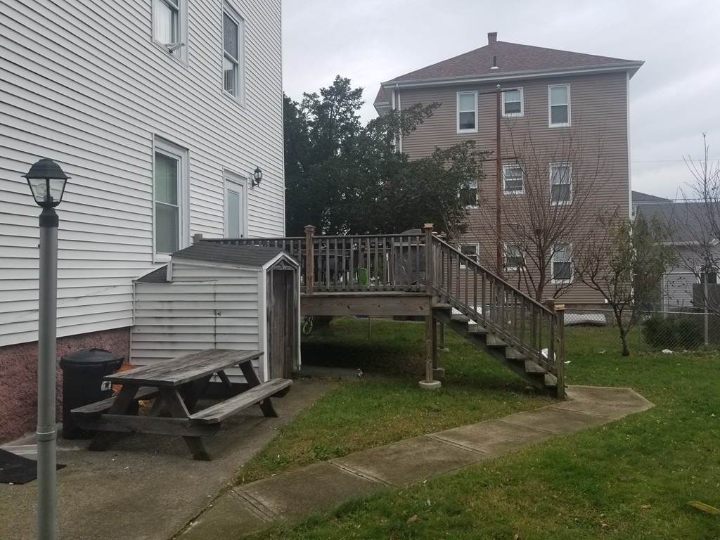 18 Mott Street Fall River, MA 02721 - Photo 22 of 27 a view of a house with a yard