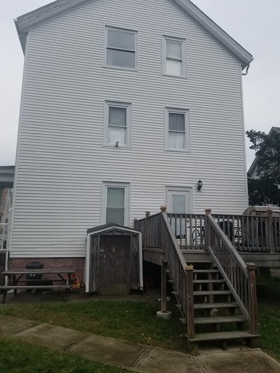 18 Mott Street Fall River, MA 02721 - Photo 23 of 27 a view of a house with backyard and deck