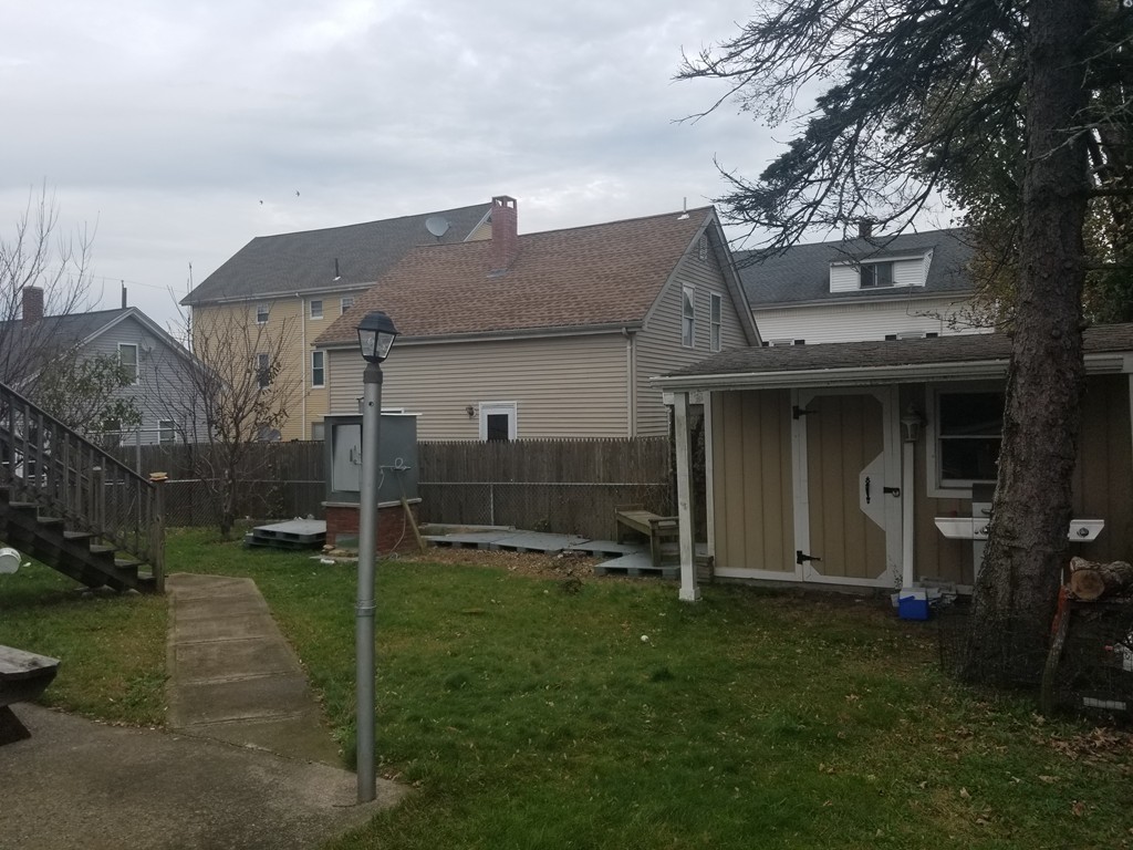 18 Mott Street Fall River, MA 02721 - Photo 24 of 27 a front view of house with a garden