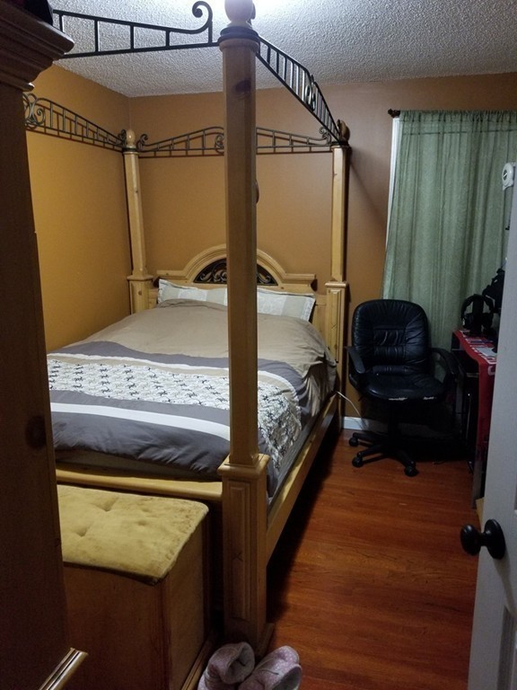 18 Mott Street Fall River, MA 02721 - Photo 6 of 27 a bedroom with a bed and a mirror