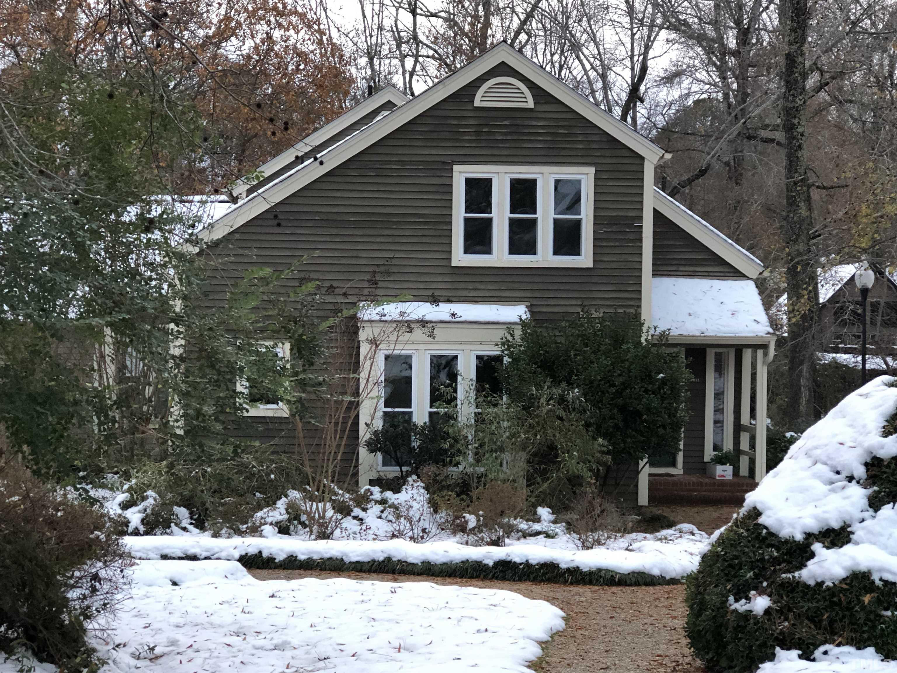 5811 Sentinel Drive Raleigh, NC 27609 - Photo 12 of 20 a front view of a house with a yard