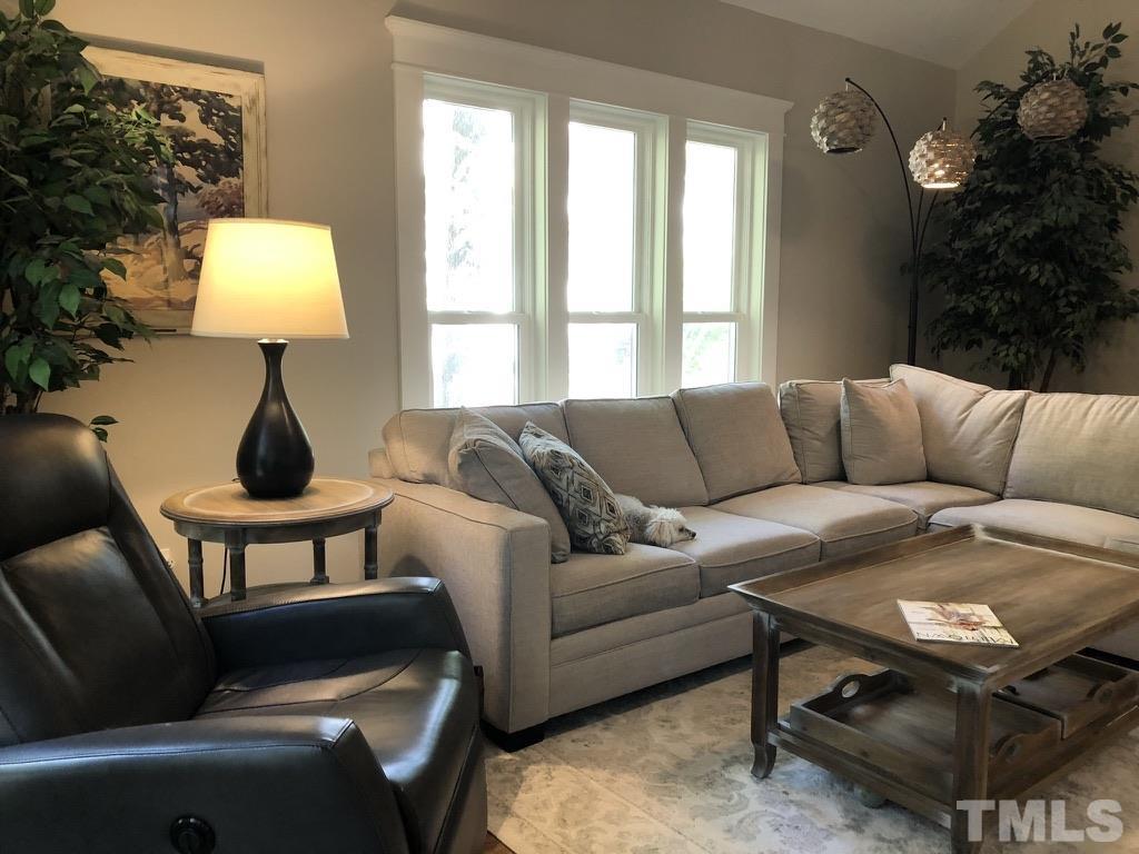 5811 Sentinel Drive Raleigh, NC 27609 - Photo 13 of 20 a living room with furniture and a window