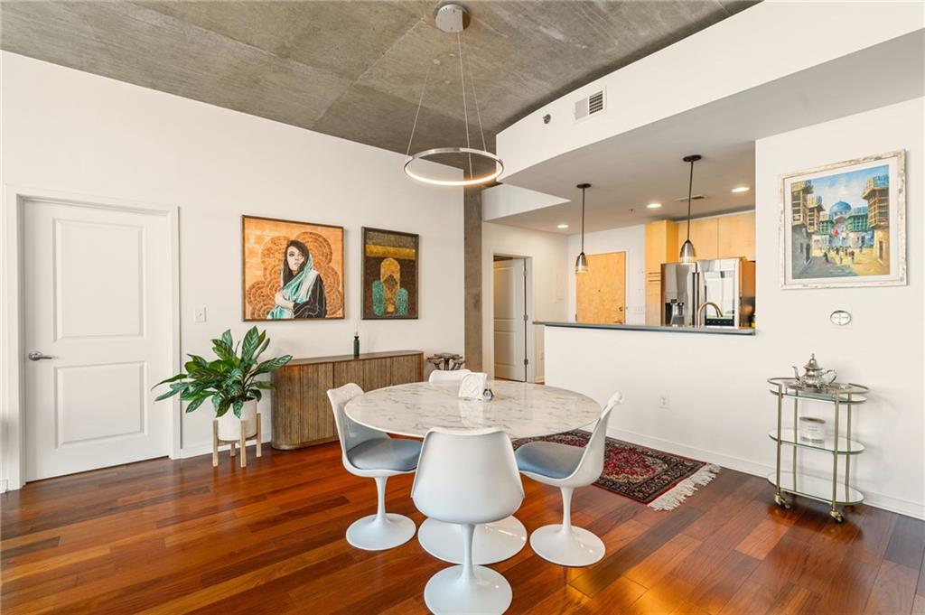 3324 Peachtree Road Northeast, Unit 2705 Atlanta, GA 30326 - Photo 14 of 68 a view of a dining room with furniture and wooden floor