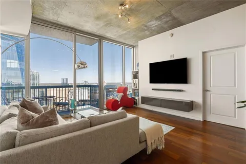 a living room with furniture and a flat screen tv