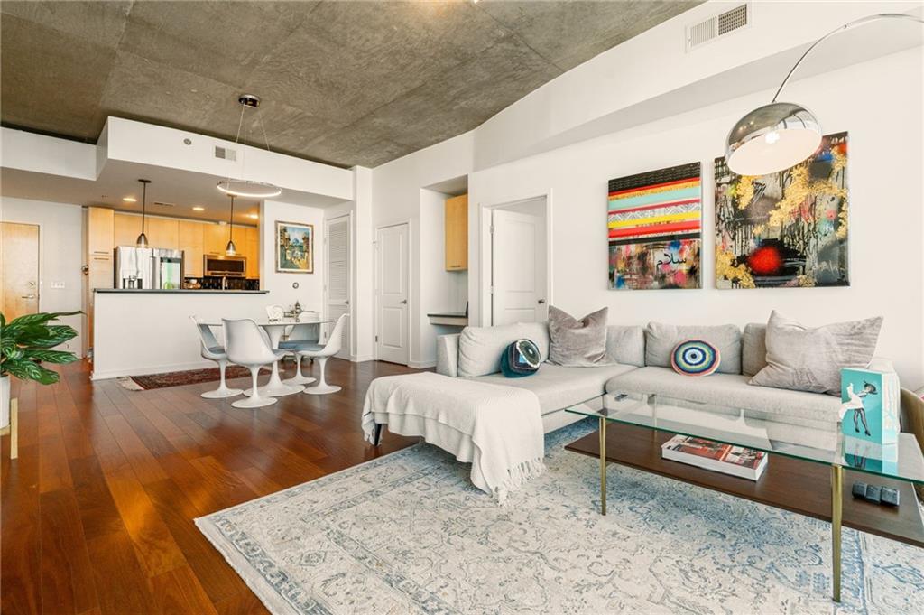 3324 Peachtree Road Northeast, Unit 2705 Atlanta, GA 30326 - Photo 19 of 68 a living room with furniture and wooden floor
