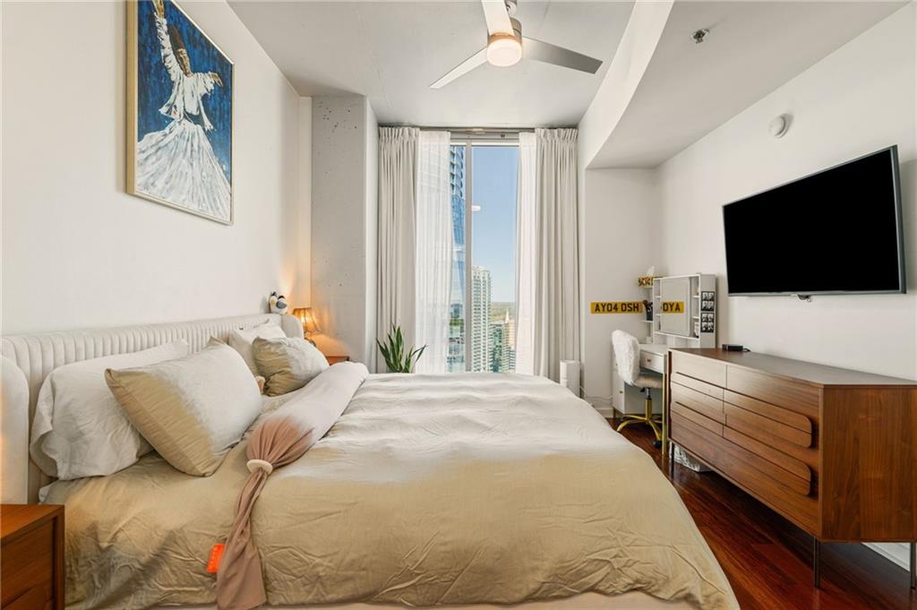3324 Peachtree Road Northeast, Unit 2705 Atlanta, GA 30326 - Photo 21 of 68 a bedroom with a bed and a flat screen tv