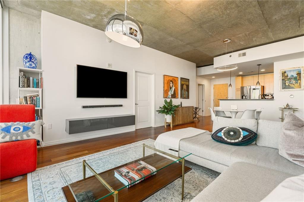 3324 Peachtree Road Northeast, Unit 2705 Atlanta, GA 30326 - Photo 22 of 68 a living room with furniture and a flat screen tv
