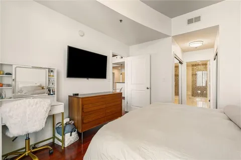 a bedroom with a bed and a table in it