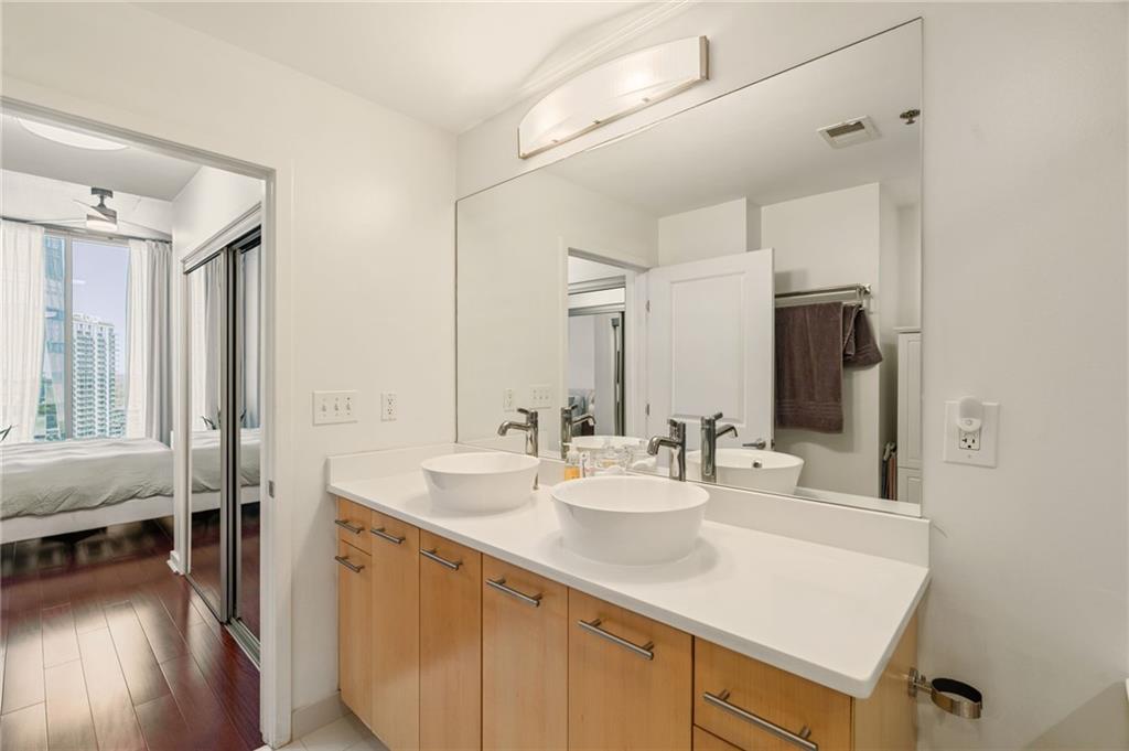 3324 Peachtree Road Northeast, Unit 2705 Atlanta, GA 30326 - Photo 30 of 68 a bathroom with a sink and a mirror