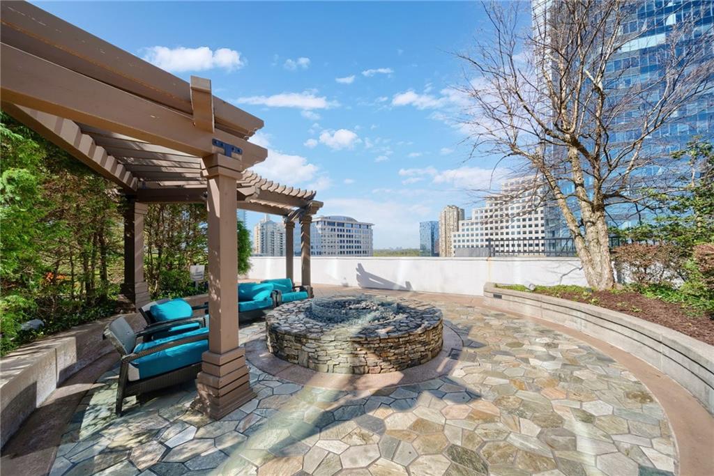 3324 Peachtree Road Northeast, Unit 2705 Atlanta, GA 30326 - Photo 63 of 68 a view of a patio with a large tree