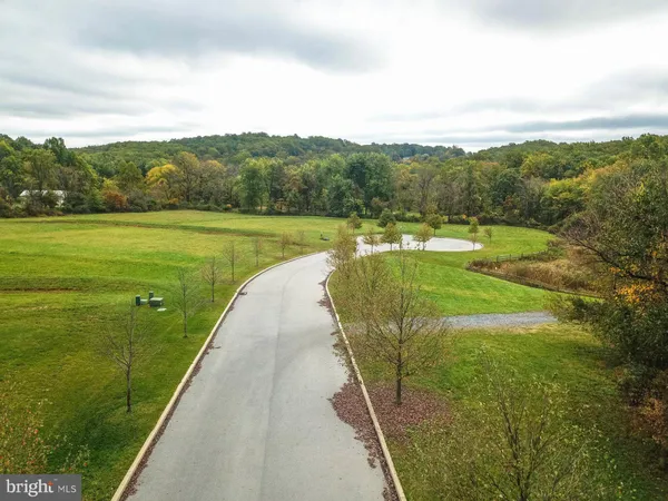 a view of a lake with a yard
