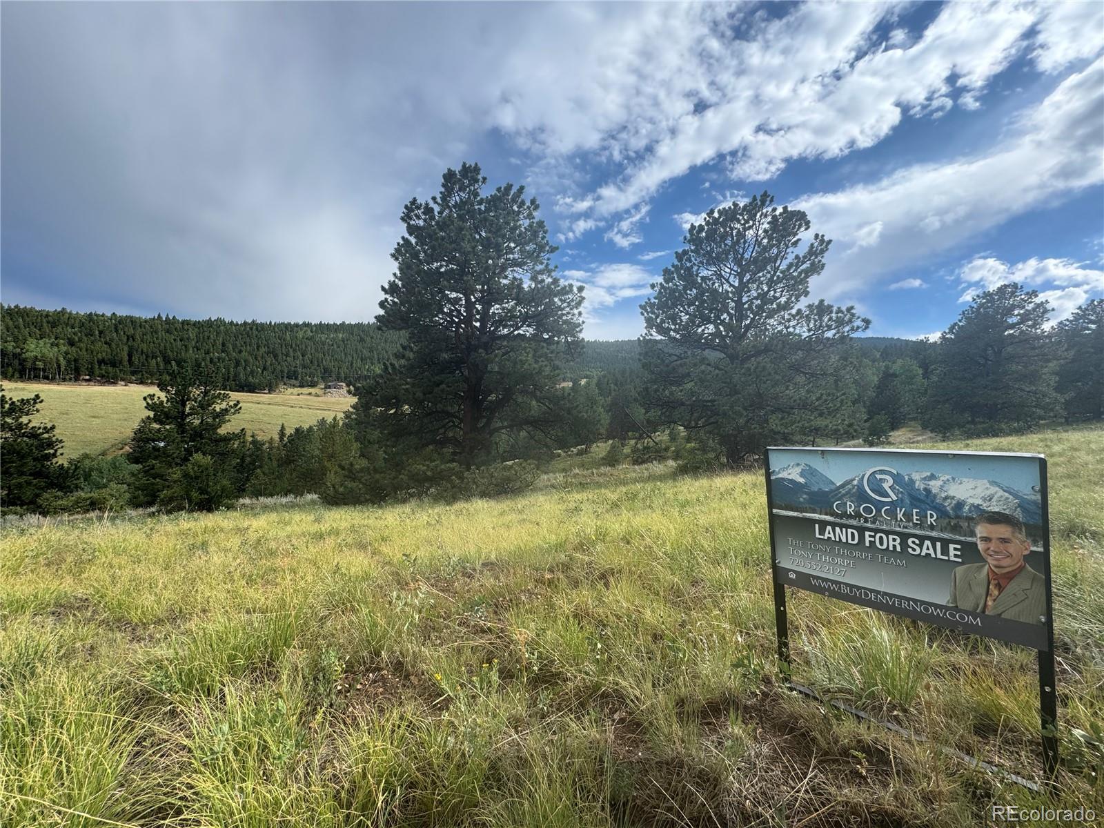 3 Church Placer Road Central City, CO 80427 - Photo 9 of 17 a view of a lake with houses in the back