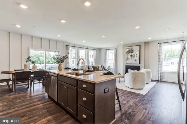 a kitchen with a stove a sink and a refrigerator