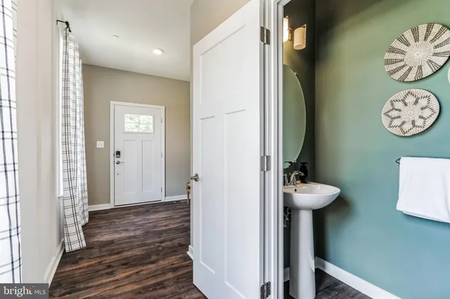 an empty room with windows and cabinet