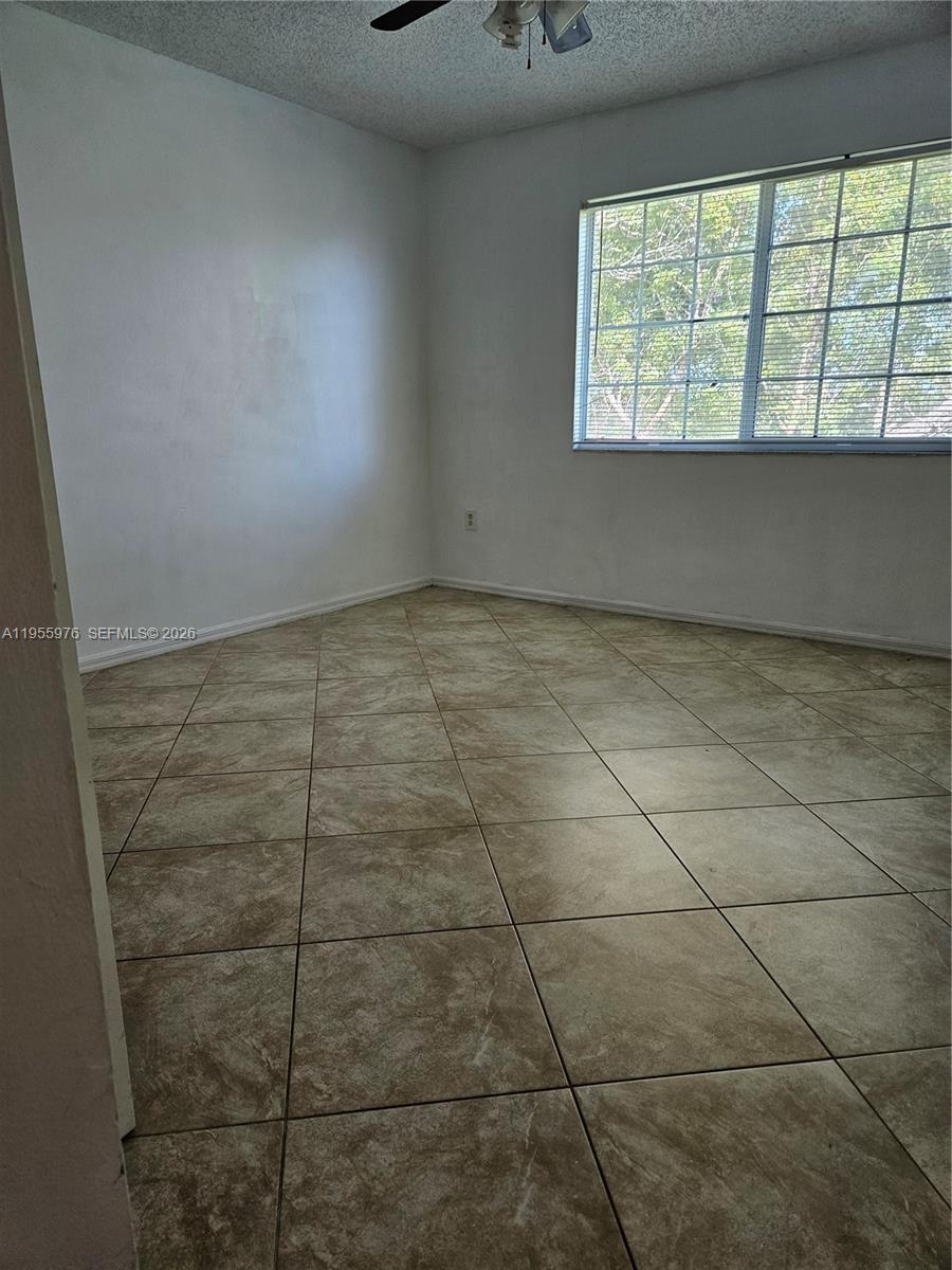 5011 Wiles Road, Unit 306 Coconut Creek, FL 33073 - Photo 15 of 17 a bathroom with a window