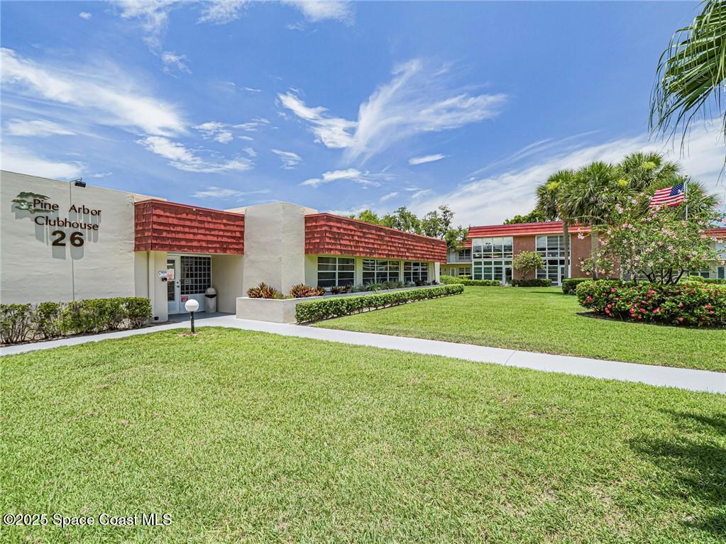 25 Pine Arbor Lane, Unit 104 Vero Beach, FL 32962 - Photo 16 of 34 a view of a house with a big yard plants and large trees