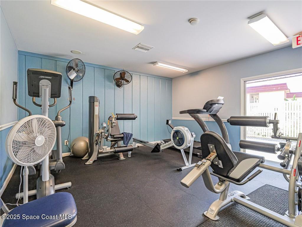 25 Pine Arbor Lane, Unit 104 Vero Beach, FL 32962 - Photo 20 of 34 a room with gym equipment