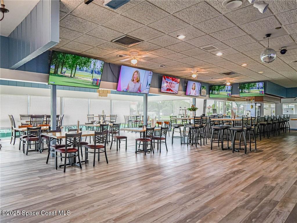 25 Pine Arbor Lane, Unit 104 Vero Beach, FL 32962 - Photo 32 of 34 a dinning table and chairs in a patio