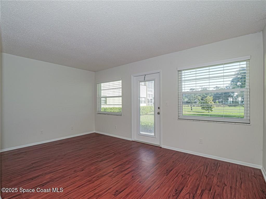 25 Pine Arbor Lane, Unit 104 Vero Beach, FL 32962 - Photo 5 of 34 an empty room that has a window