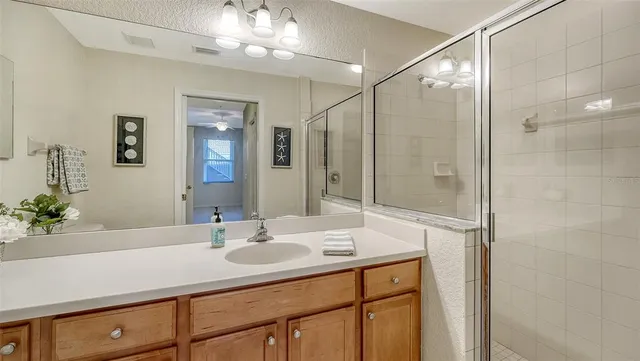 an aerial view of residential houses with outdoor space and swimming pool