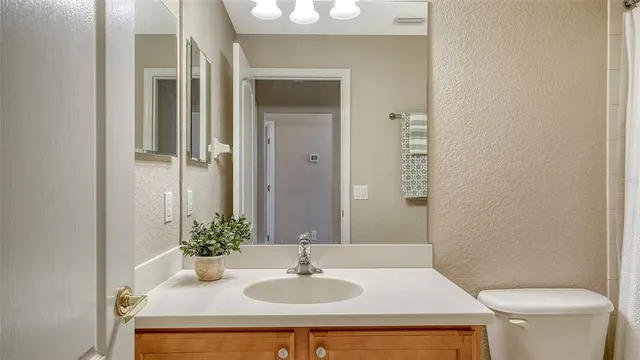 a view of a swimming pool and an outdoor seating