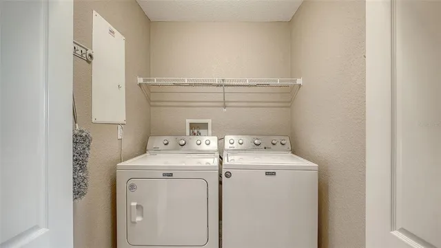 an aerial view of residential houses with outdoor space and swimming pool