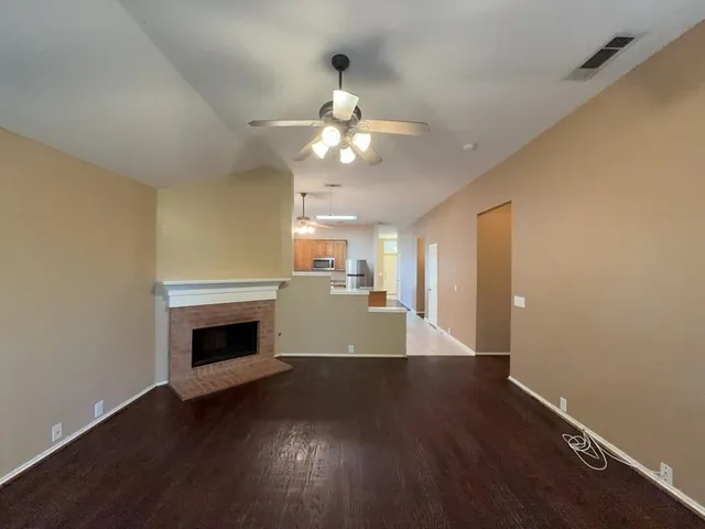 a view of livingroom and kitchen with wooden floor