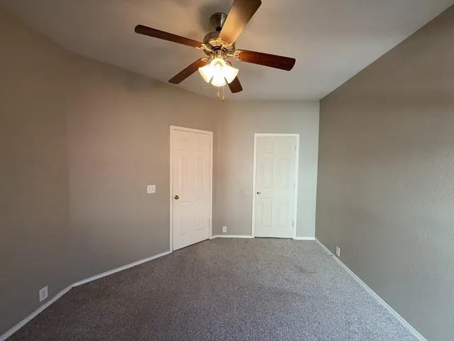 a view of a livingroom with a ceiling fan