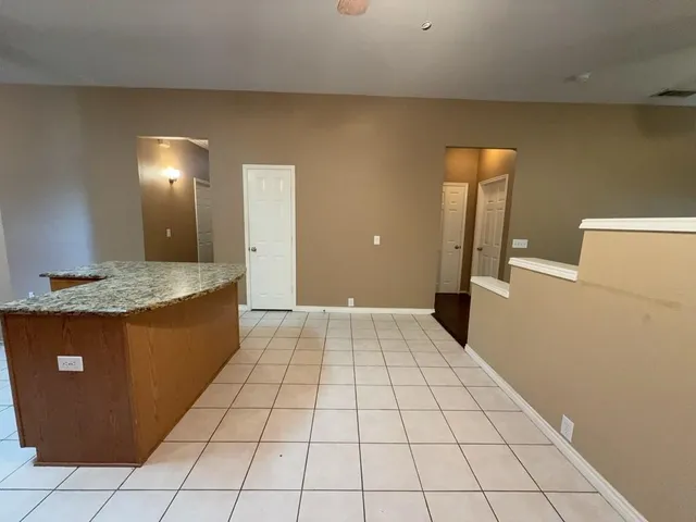 a view of a kitchen with a sink