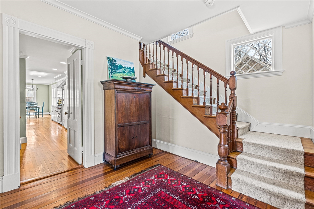 7 Water Street Natick, MA 01760 - Photo 11 of 26 a view of entryway with wooden floor and stairs