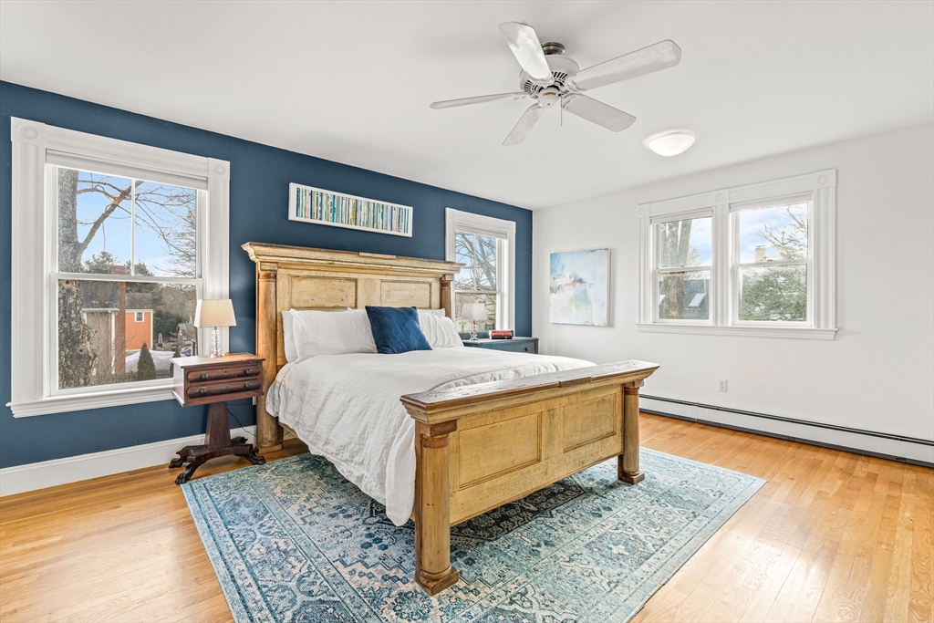 7 Water Street Natick, MA 01760 - Photo 12 of 26 a bed sitting in a bedroom next to a window