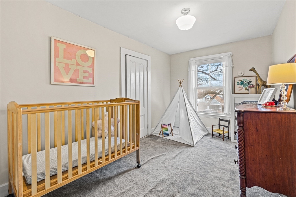 7 Water Street Natick, MA 01760 - Photo 16 of 26 a view of a livingroom with furniture and windows
