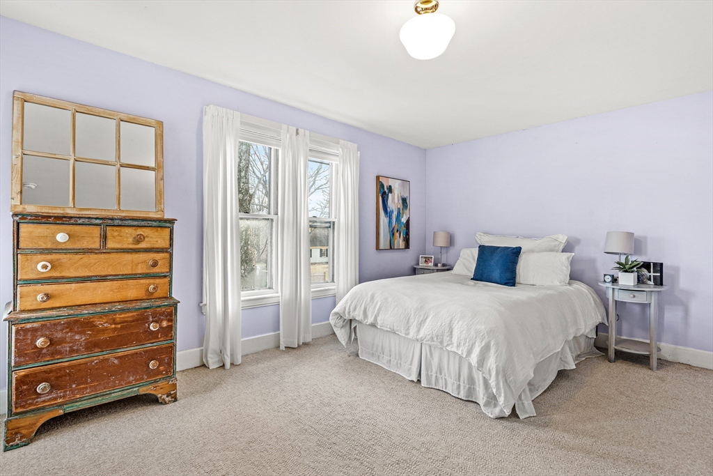 7 Water Street Natick, MA 01760 - Photo 18 of 26 a bedroom with a bed and a cabinets
