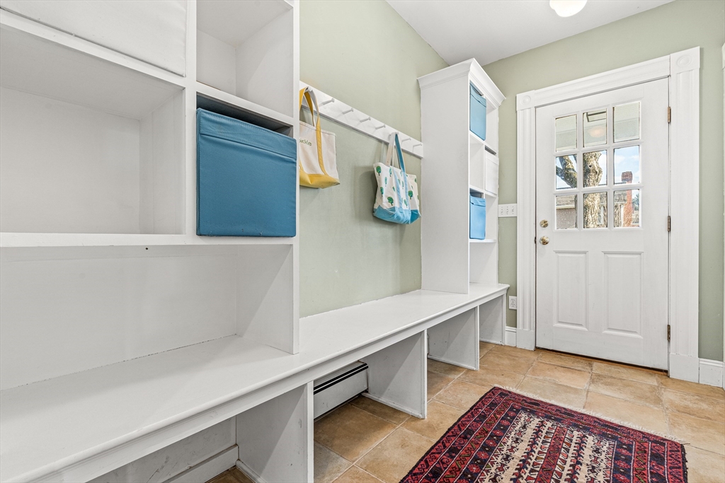7 Water Street Natick, MA 01760 - Photo 21 of 26 a view of hallway with wooden floor and stairs