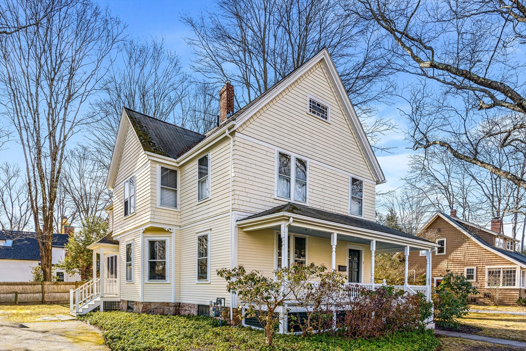 7 Water Street Natick, MA 01760 - Photo 22 of 26 a view of a white house with a yard