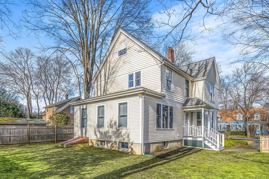 7 Water Street Natick, MA 01760 - Photo 23 of 26 a front view of house with yard and green space