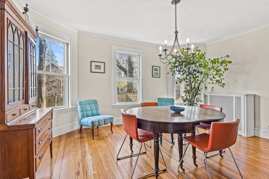 7 Water Street Natick, MA 01760 - Photo 3 of 26 a view of a dining room with furniture window and wooden floor