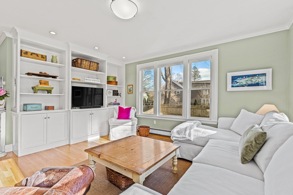 7 Water Street Natick, MA 01760 - Photo 7 of 26 a living room with furniture and a flat screen tv